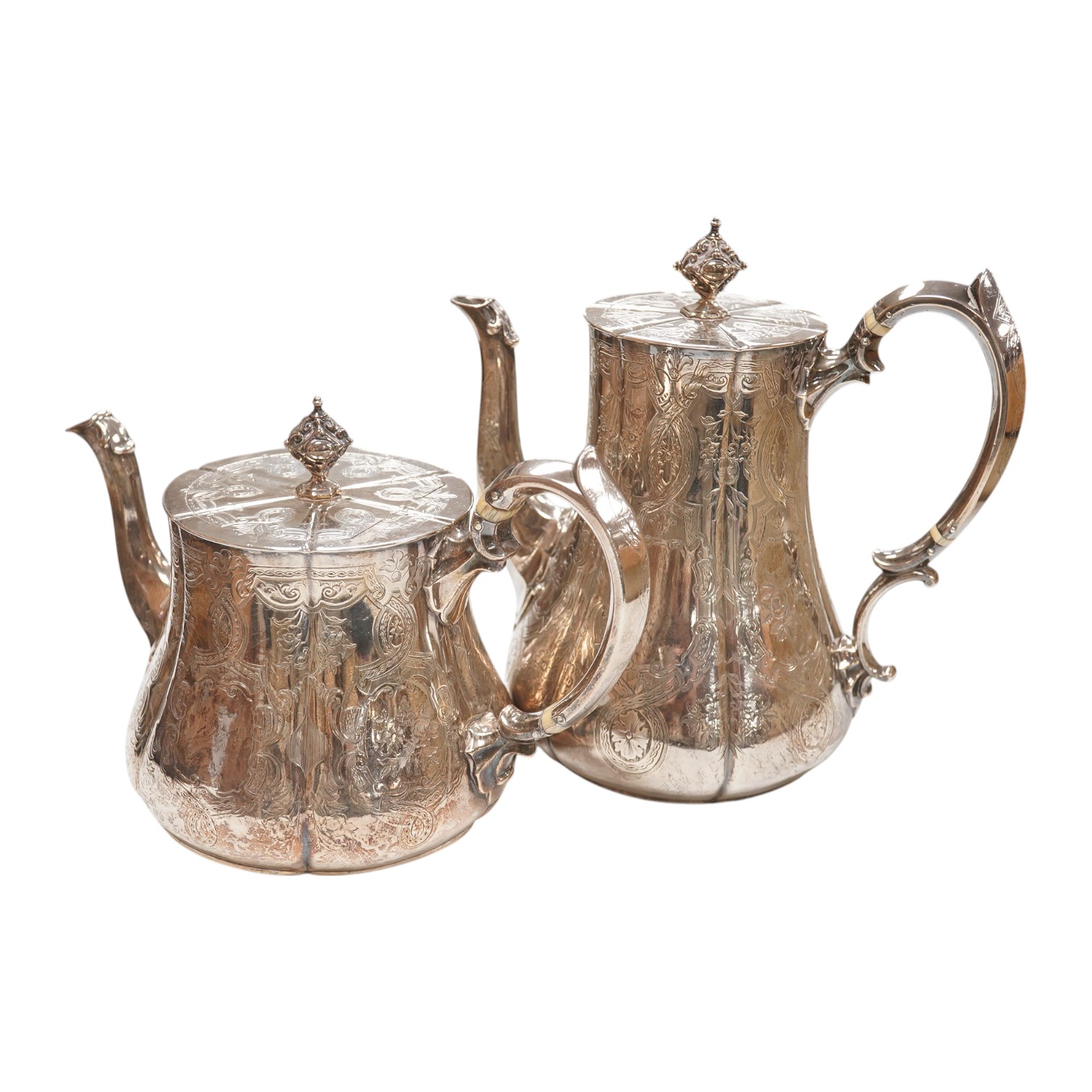 A Victorian engraved silver teapot and matching coffee pot, by George Ivory, London, 1857, gross weight 46.2oz. CITES Submission reference 4K2AZFRW. Condition - fair to good